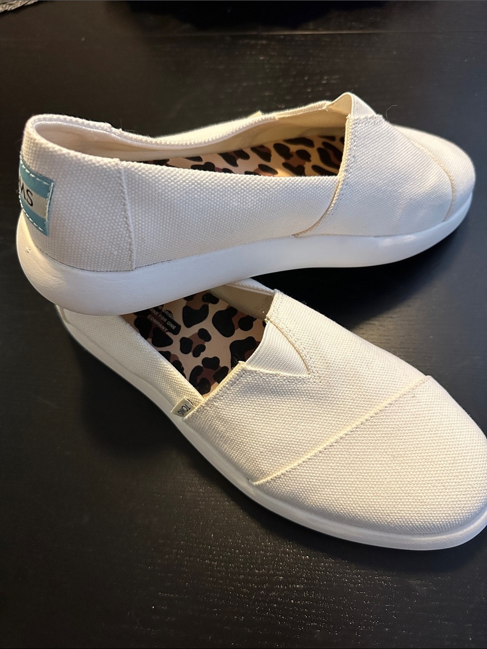 Tom’s White Slip-ons
